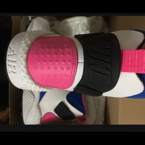 White and rose Hurricane Nike boots